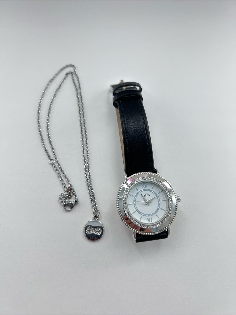 Silver Crystal Bezel Watch with Black Leather Strap